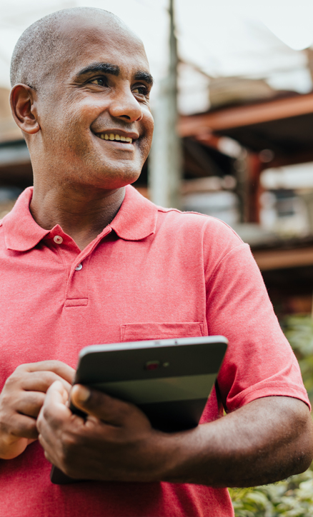 Happy man using a tablet