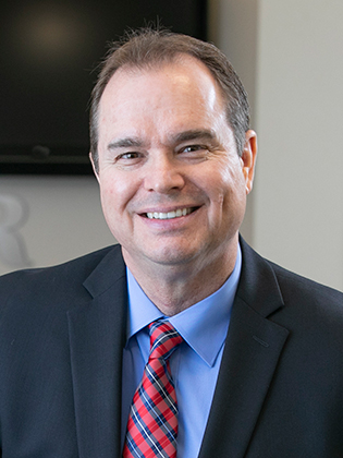 A person in front of a background.