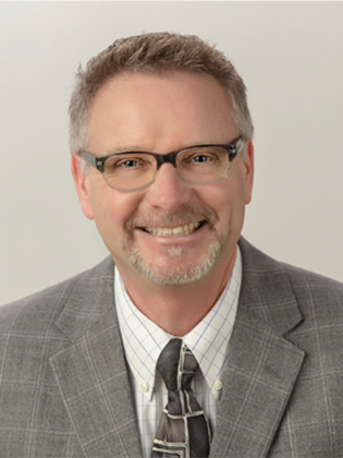 A person in front of a background.